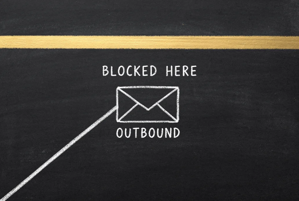 A chalk line rising to an envelope labelled OUTBOUND that stops short of a full-width gold bar labelled BLOCKED HERE, with empty board beyond it.